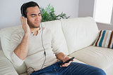 Relaxed handsome man listening to music