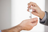 Estate agent giving key to customer