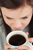 Girl drinking a cup of coffee