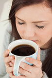 Relaxed girl drinking a cup of coffee