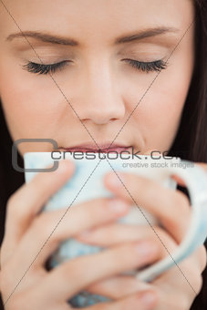 Girl holding a cup of coffee