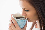 Calm girl drinking a cup of coffee