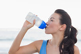 Woman drinking after exercising