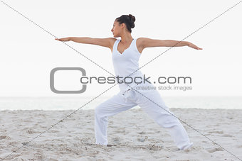 Brunette woman stretching in yoga pose