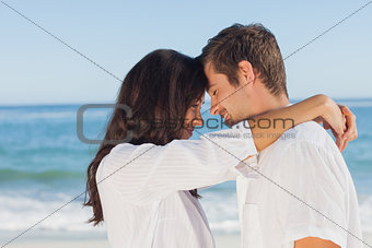 Couple embracing each other on the beach
