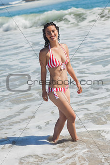 Beautiful woman walking down the beach