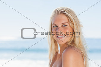 Close up view of blonde woman smiling at camera