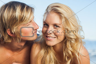 Close up view of couple lying while woman looking at camera