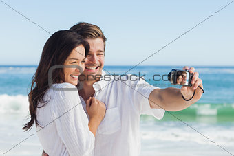 Happy couple taking a photo
