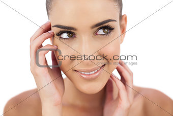 Close up of a smiling woman looking away