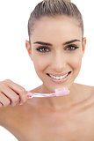 Smiling woman holding a toothbrush