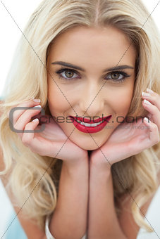 Close up of a smiling blonde model looking at camera