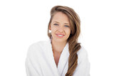 Delighted brunette in bathrobe looking at camera