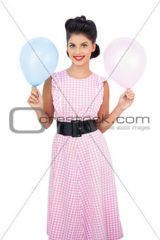 Happy black hair model holding balloons