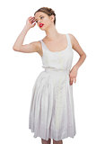 Attractive model in white dress posing
