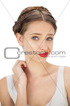 Confused model posing wrinkling her mouth
