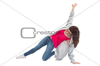 Pretty young woman making hip hop pose
