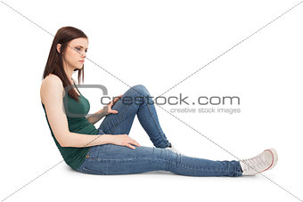 Thoughtful attractive brunette sitting