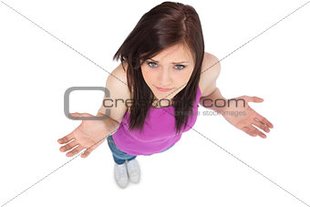 High angle view of uncertain brunette posing