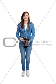Smiling young photographer posing