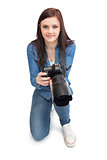 Cheerful young photographer posing