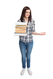 Smiling pretty student holding pile of books