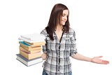 Cheerful pretty student holding pile of books