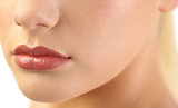 Close up on voluminous glossy lips