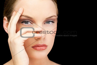 Glamorous young model posing hand on face