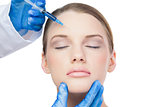 Content attractive model having botox injection on the forehead