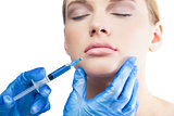 Relaxed pretty model having botox injection on the lips