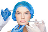 Surgeons making injection on calm blonde wearing blue surgical cap
