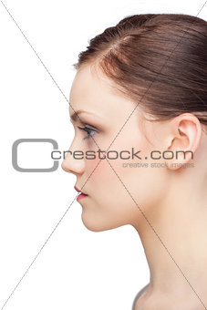 Profile view of serious fresh brunette posing