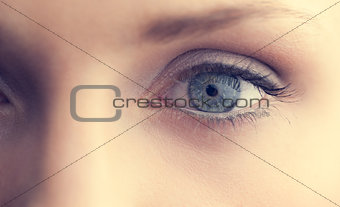 Extreme close up on beautiful shinning blue eye