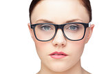 Serious natural model wearing classy glasses