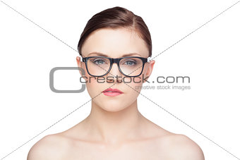 Pensive natural model wearing classy glasses