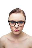 Unsmiling clean model with classy glasses posing