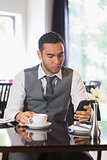 Businessman having coffee in restaurant