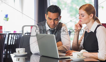 Business team working together in a cafe