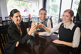 Business team celebrating a success with champagne in restaurant