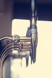 Silver beer taps close up