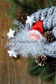 Christmas composition with a knitted scarf and decorations