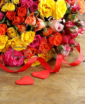 different color roses (yellow, red, pink) may be used as the background