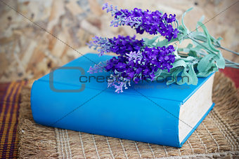 Book and lavender flowers