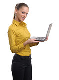 Pretty young businesswoman working on laptop