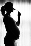 silhouette of a pregnant woman on a white background
