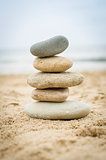 Stones piled up on a sand beach