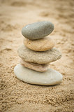 Stones piled up on a sand beach