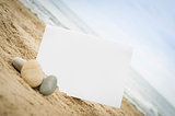 Blank white sign on the beach