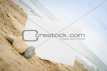 Blank white sign on the beach